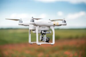 Agriculture drone flying on the green field
